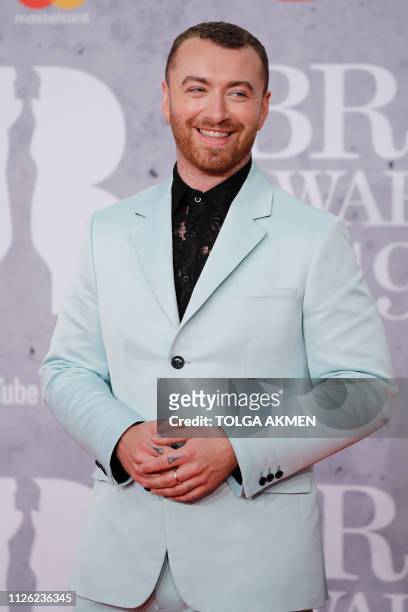 British singer-songwriter Sam Smith poses on the red carpet on arrival for the BRIT Awards 2019 in London on February 20, 2019. / RESTRICTED TO...