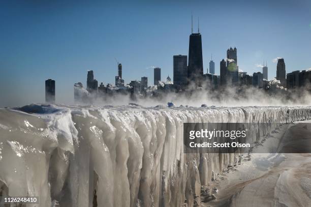 Ice covers the Lake Michigan shoreline on January 30, 2019 in Chicago, Illinois. Businesses and schools have closed, Amtrak has suspended service...