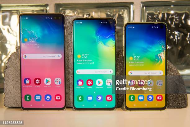 Samsung Electronics Co. S10+, from left, S10 and S10e smartphones are arranged for a photograph ahead of the Samsung Unpacked product launch event in...