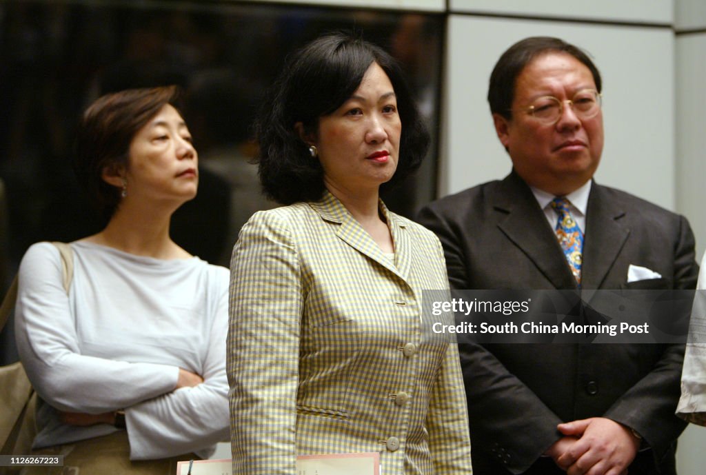 Top officials (from left) Sarah Liao Sau-tung, Secretary Environment Transport and Works; Regina Ip Lau Suk-yee, Secretary for Security, and Patrick Ho Chi-ping, Secretary for Home Affairs, standing behind Chief Excutive Tung Chee-hwa while the Chief Exec
