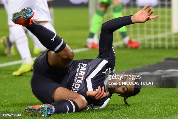 Bordeaux's French defender Jules Kounde reacts as he falls during the French L1 football match between Girondins de Bordeaux and En avant de Guingamp...
