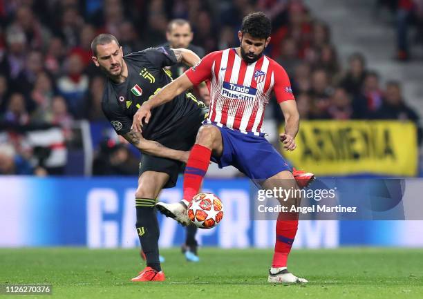 Diego Costa of Atletico Madrid is challenged by Leonardo Bonucci of Juventus during the UEFA Champions League Round of 16 First Leg match between...
