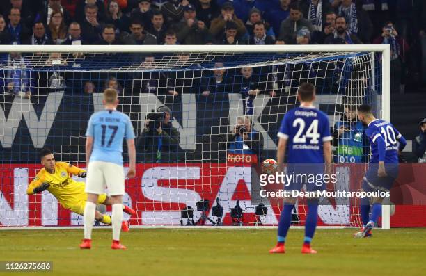 Nabil Bentaleb of FC Schalke 04 scores his team's first goal from the penalty spot during the UEFA Champions League Round of 16 First Leg match...