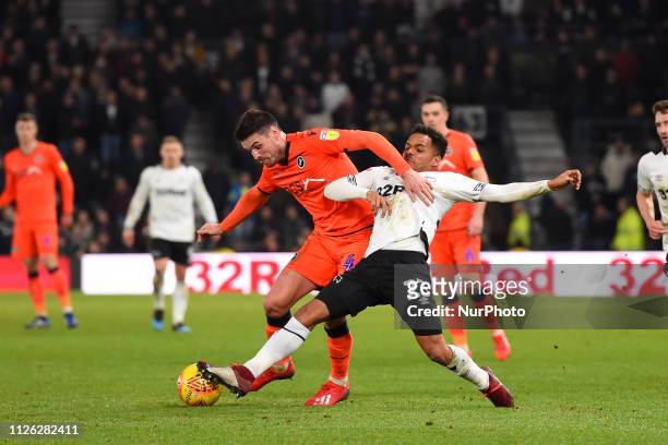 Millwall midfielder Ben Marshall battles with Derby County midfielder Duane Holmes during the Sky Bet Championship match between Derby County and...