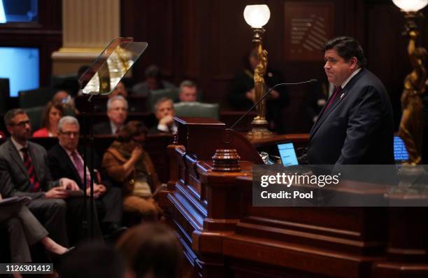Illinois Gov. J.B. Pritzker delivers his first budget address to a joint session of the Illinois House and Senate at the Illinois State Capitol on...