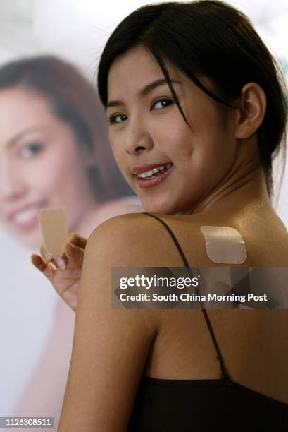 The contraceptive patch EVRA patch - available only with a doctor's prescription - is introduced in Hong Kong, with models showing how to use it, at...