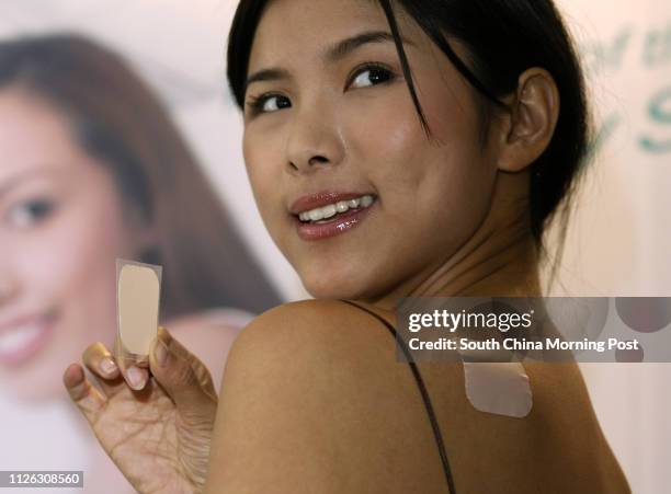 The contraceptive patch EVRA patch - available only with a doctor's prescription - is introduced in Hong Kong, with models showing how to use it, at...