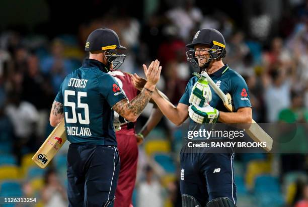 Ben Stokes and Jos Buttler of England celebrate winning the 1st ODI between West Indies and England at Kensington Oval, Bridgetown, Barbados, on...