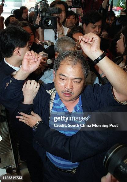 Kin Shing Activist Tsang Kin-shing shows his broken spectacles when he was ...