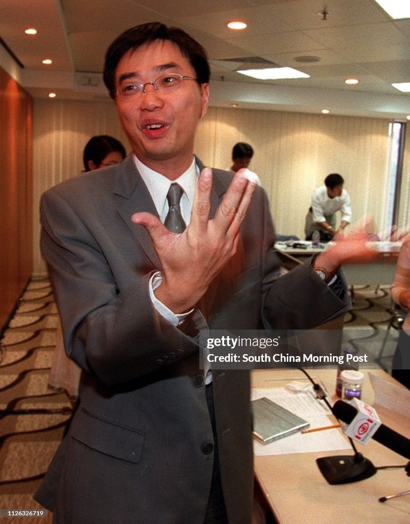 Almon Yu Ngai-cheung, chief executive of Sun Hung Kai Logistics , makes a point as he is interviewed during a luncheon of the Hong Kong General Chamber of Commerce on June 11, 2002.