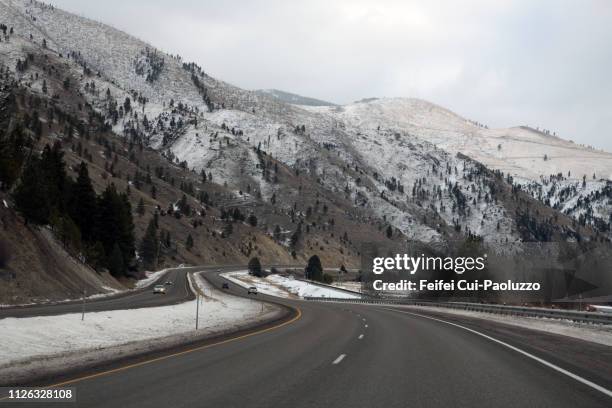 highway near missoula, montana, usa - montana moody sky stock pictures, royalty-free photos & images