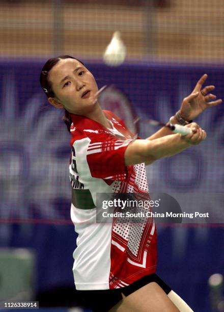 Wang Chen playing a shot during her win over Malaysia's Wong Mew Choo at the Asian Games in Pusan, South Korea. 10 October 2002