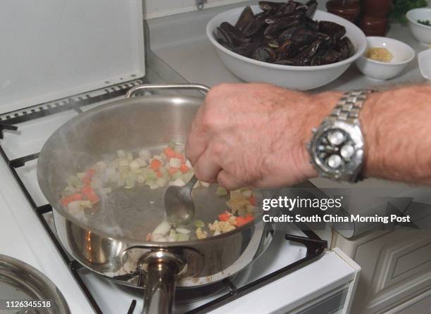 Pieter Onderwater, chef and boss of Orange Tree Restaurant, cooking at his home in Discovery Bay, Lantau. 16 December 2002