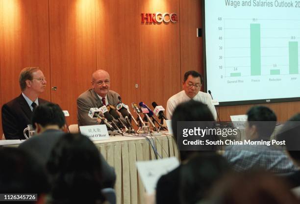 The Hong Kong General Chamber of Commerce holding an Annual Business Prospects Survey press conference. From left are members David O'Rear, Ian...