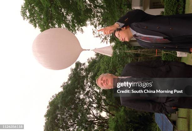 Governor Chris Patten visits the Royal Observatory and has Director of the department Mr Robert Lau explains to him about the weather. Photo by C.Y....