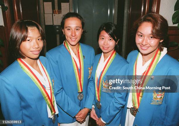 HONG KONG'S 4 X 100 METRES RELAY SWIMMERS KATIE LAU, FENELLA NG, VIVIAN LEE AND ROBYN LAMSAM BELATEDLY RECEIVED THEIR ASIAN GAMES SILVER MEDALS AFTER...