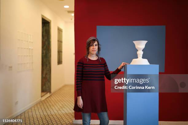 portrait of woman artist next to ceramics sculpture in gallery - modern art gallery stock pictures, royalty-free photos & images