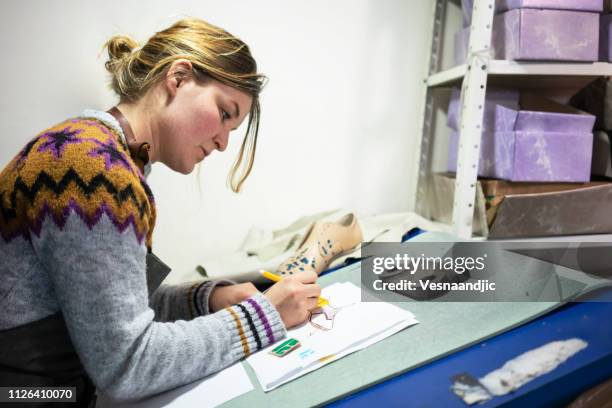 woman shoemaker working at her workshop - mold on shoes stock pictures, royalty-free photos & images