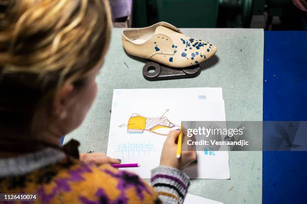 woman shoemaker working at her workshop - mold on shoes stock pictures, royalty-free photos & images