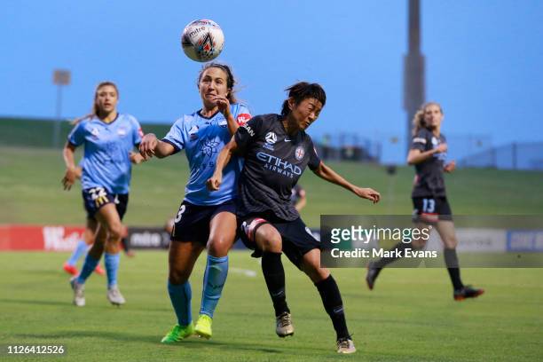 Danielle Colaprico of Sydney FC competes for the ball with Yukari Kinga of Melbourne City during the round 14 W-League match between Sydney FC and...