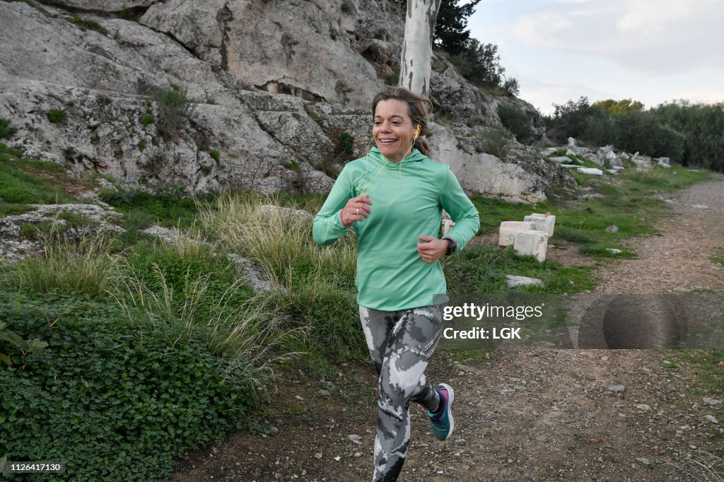 Woman running  in a city park