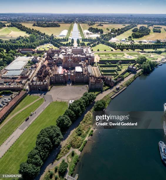 Aerial view of Hampton Court Palace on June 22nd 2018. This Tudor palace, presently owned by the Queen, is located on the River Thames, between...