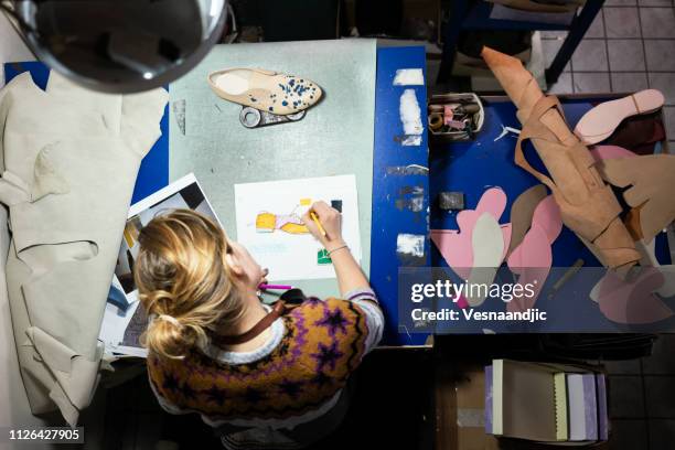woman shoemaker working at her workshop - mold on shoes stock pictures, royalty-free photos & images