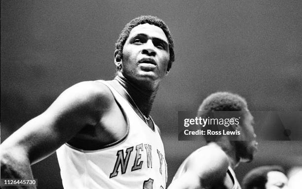 Willis Reed, center of the New York Knicks, takes a brief pause to look at the scoreboard during an NBA basketball game against the Buffalo Braves in...