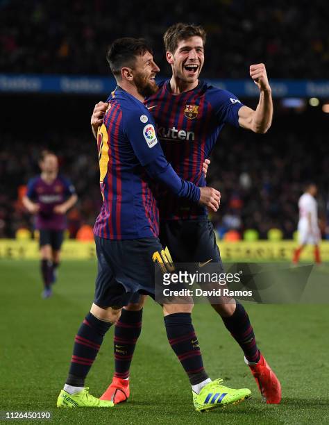 Sergio Roberto of FC Barcelona celebrates with his team mate Lionel Messi after scoring his team's fourth goal during the Copa del Quarter Final...