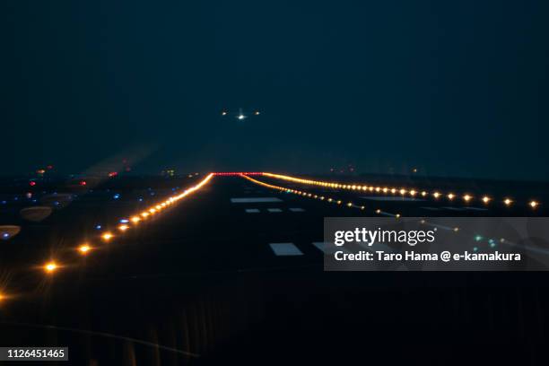 the airplane taking off tokyo haneda international airport (hnd) in japan - airplane lights stock pictures, royalty-free photos & images