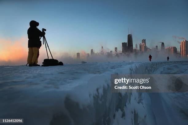 Photographers shoot the sunrise despite temperatures hovering around -20 degrees and wind chills nearing -50 degrees on January 31, 2019 in Chicago,...