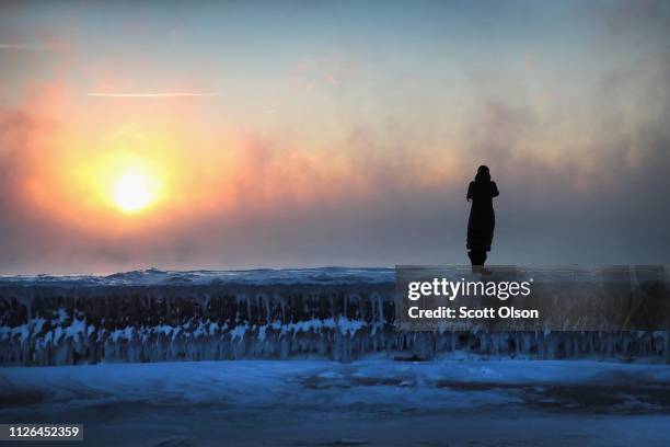 Photographers shoot the sunrise despite temperatures hovering around -20 degrees and wind chills nearing -50 degrees on January 31, 2019 in Chicago,...