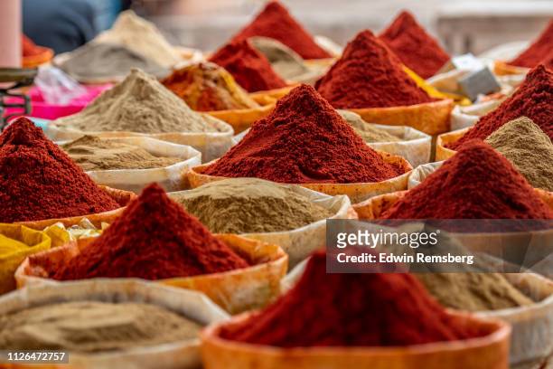 mounds of spices - spice stock pictures, royalty-free photos & images