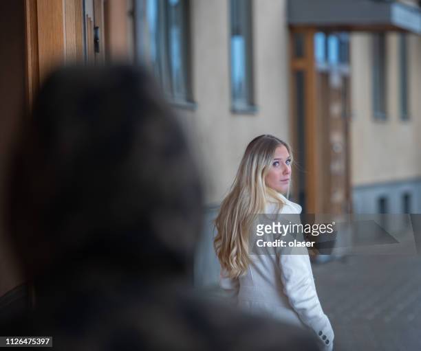 worried young woman being followed - following stock pictures, royalty-free photos & images