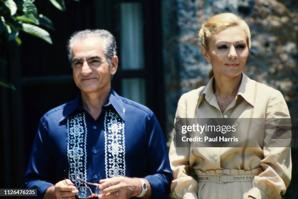 Shah of Iran and his now widow Farah Pahlavi after they left Iran in exile pose outside a mansion June 14, 1979 Cuernavaca, Mexico