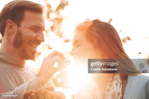 couple sharing macaroons - eating chocolate stock pictures, royalty-free photos & images