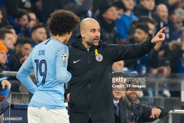 Leroy Sane of Manchester City and head coach Pep Guardiola of Manchester City during the UEFA Champions League Round of 16 First Leg match between FC...