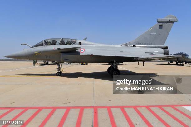 French Rafale fighter aircraft from Dassault aviation taxis towards the runway before a take off during the Aero India 2019 airshow at the Yelahanka...