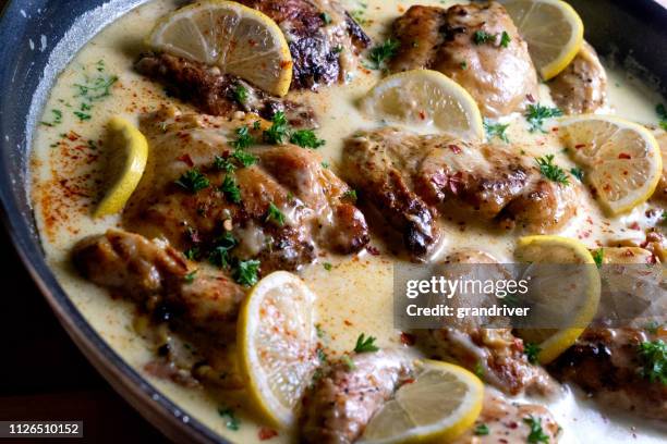 pan seared lemon chicken picatta in a creamy sauce, perfect ketogenic diet food - chicken parmigiana stock pictures, royalty-free photos & images