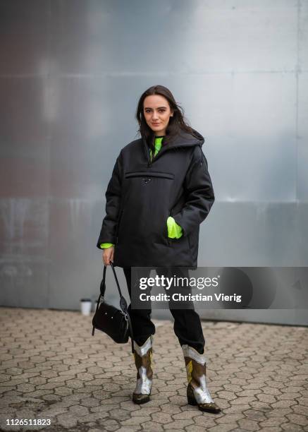 Guest is seen wearing Prada jacket, cowboy boots, black bag outside Munthe during the Copenhagen Fashion Week Autumn/Winter 2019 - Day 3 on January...