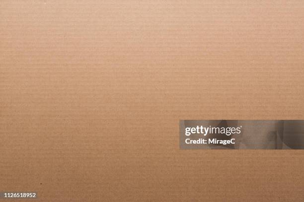 brown corrugated cardboard - karton stock-fotos und bilder