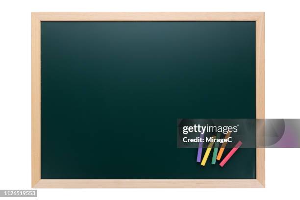 green blackboard with color chalks on white - gessetto da lavagna foto e immagini stock