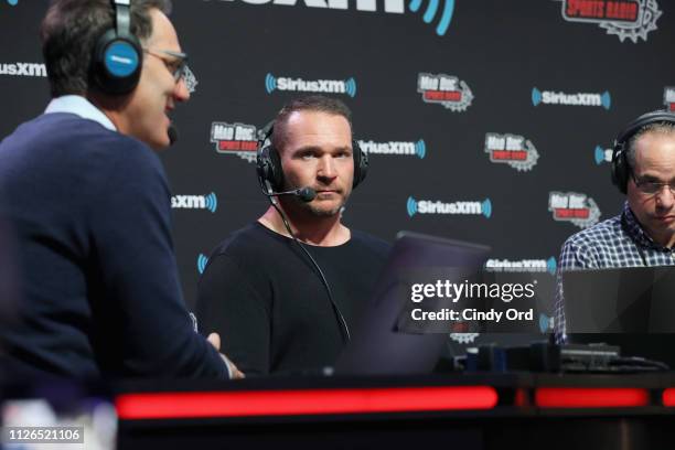 Danny Kanell, Brian Urlacher and Steve Torre attend SiriusXM at Super Bowl LIII Radio Row on January 31, 2019 in Atlanta, Georgia.