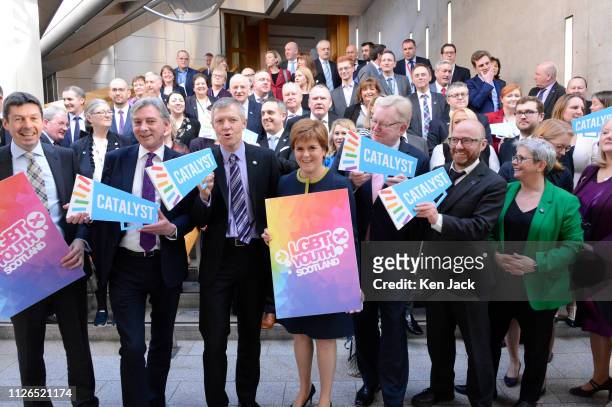 Scotland's First Minister Nicola Sturgeon with other party leaders and MSPs at a photocall in the Scottish Parliament in support of LGBT Youth,...