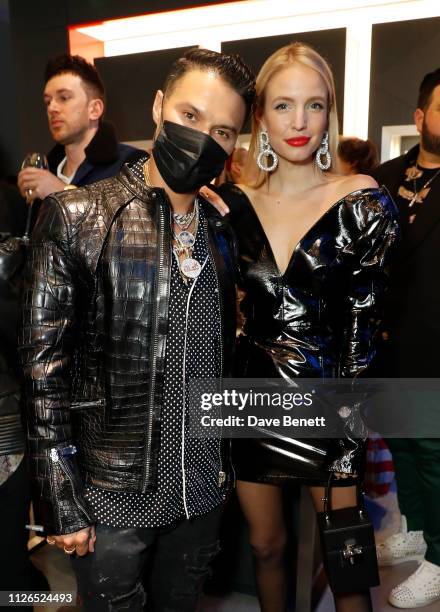 Alec Monopoly and Leonie Hanne attend TAG Heuer and art provocateur Alec Monopoly launch event celebrating special edition watches on January 31,...
