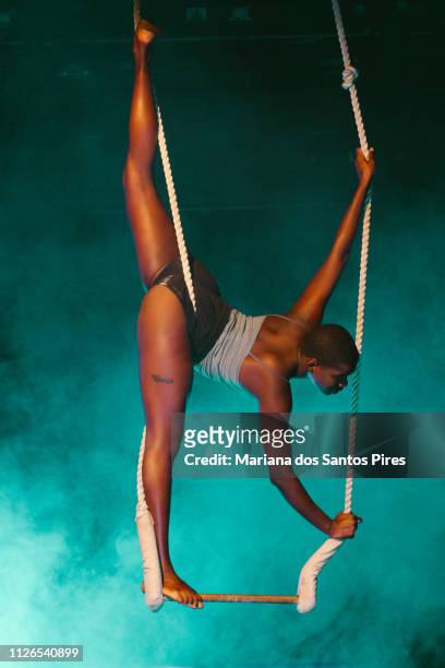 black young woman acrobat looking at camera