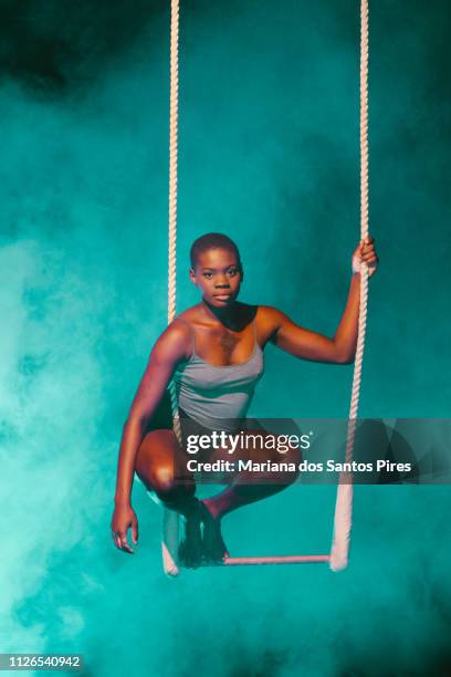 black young woman acrobat looking at camera - great job stock pictures, royalty-free photos & images