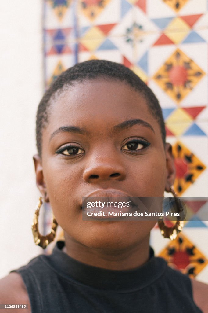 Black young woman looking at camera