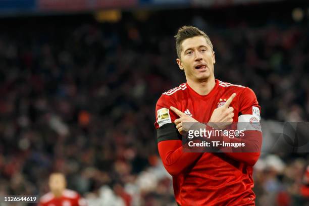 Robert Lewandowski of Bayern Muenchen celebrates after scoring his team's second goal during the DFB Cup quarter final between Bayern Muenchen and FC...
