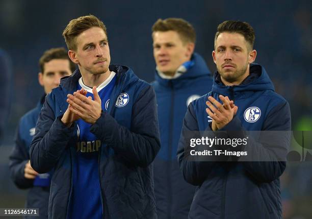 Bastian Oczipka of Schalke 04 and Mark Uth of Schalke 04 look dejected after the UEFA Champions League Round of 16 First Leg match between FC Schalke...